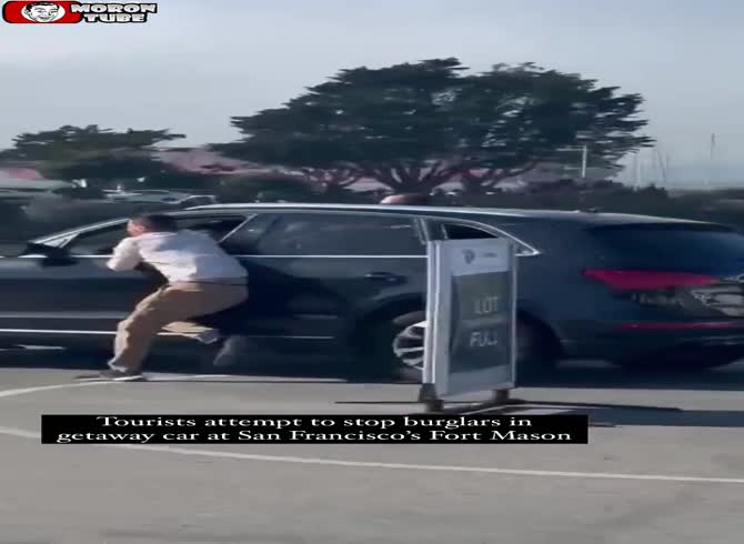 Video :In San Francisco, tourists attempt to stop a thief from taking their vehicle